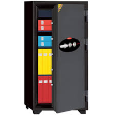 Ivory Diplomat 130 tall safe shown open with a combination dial, shelves and document folders inside.